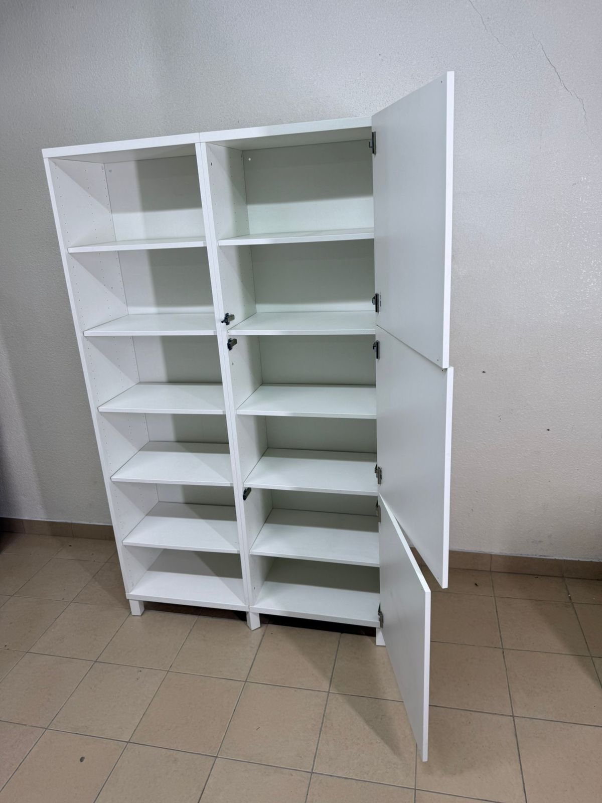 A white storage cabinet from IKEA, model BESTÅ, comes with open units and closed fronts. - Image 12
