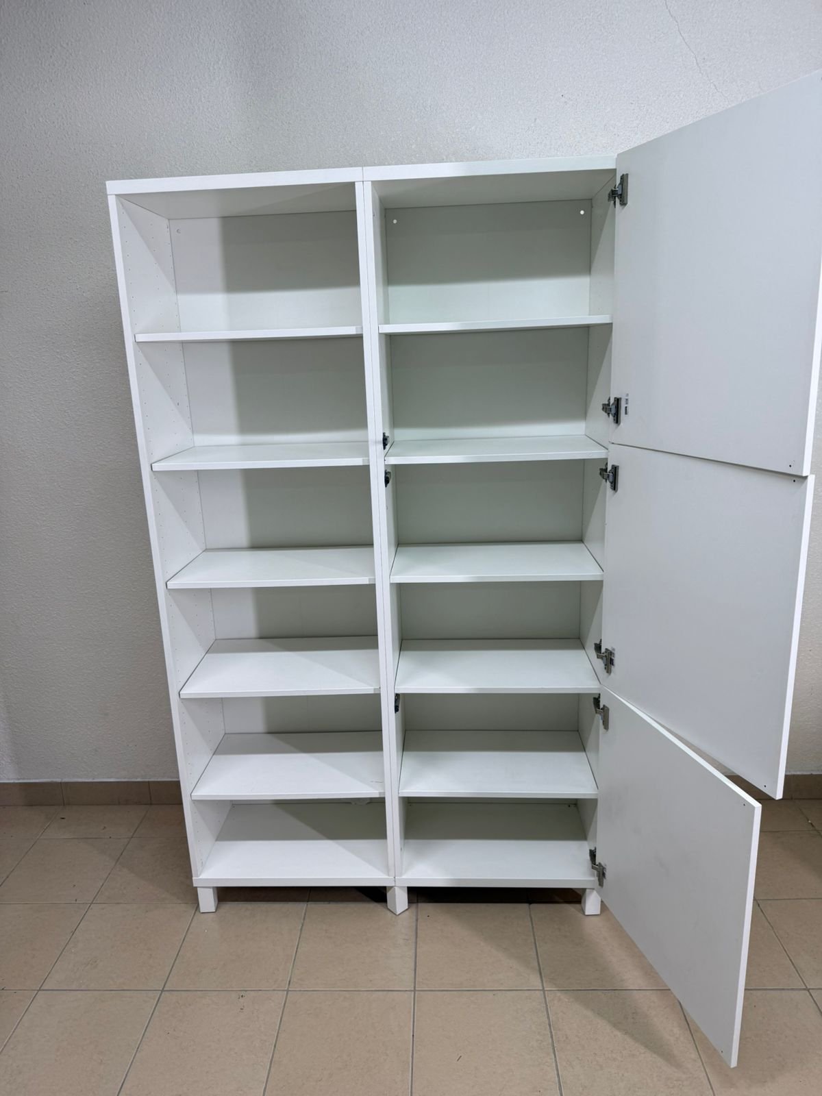 A white storage cabinet from IKEA, model BESTÅ, comes with open units and closed fronts. - Image 15