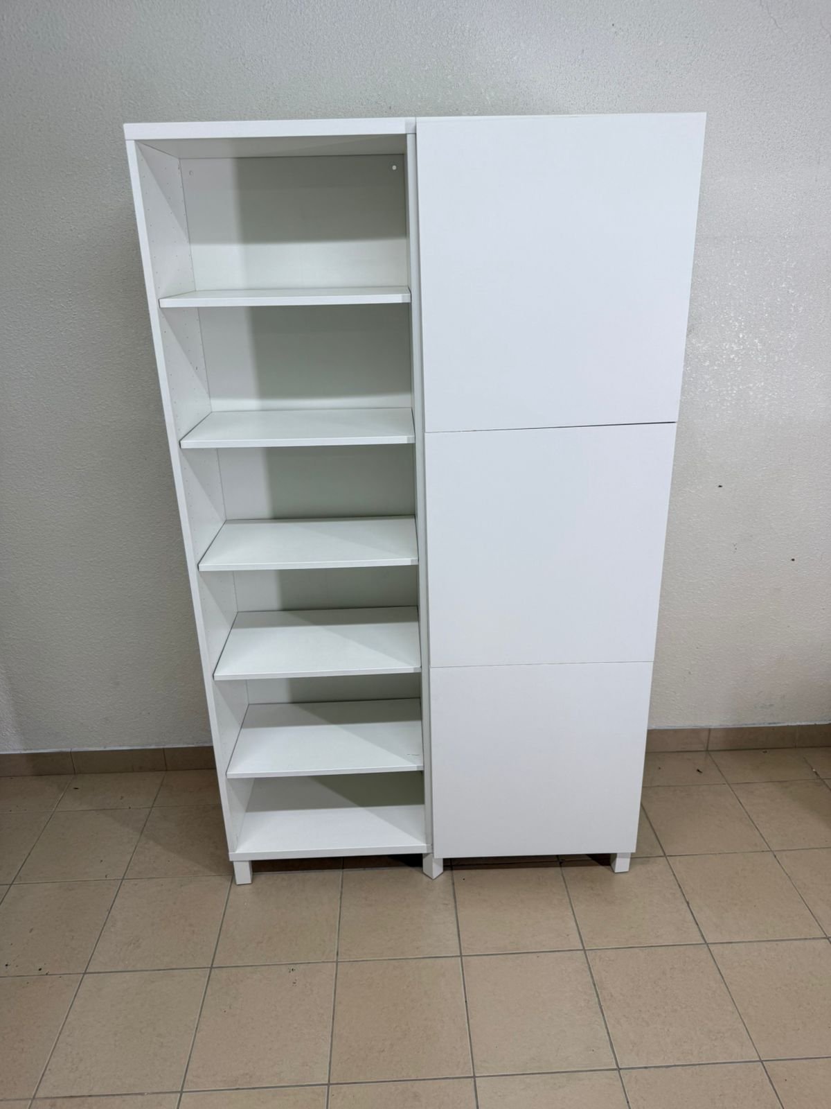 A white storage cabinet from IKEA, model BESTÅ, comes with open units and closed fronts. - Image 16