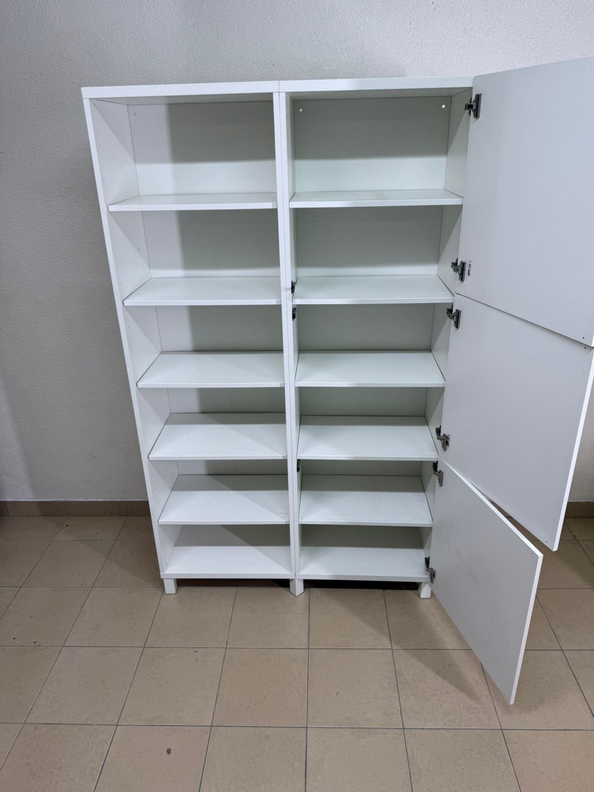 A white storage cabinet from IKEA, model BESTÅ, comes with open units and closed fronts. - Image 17
