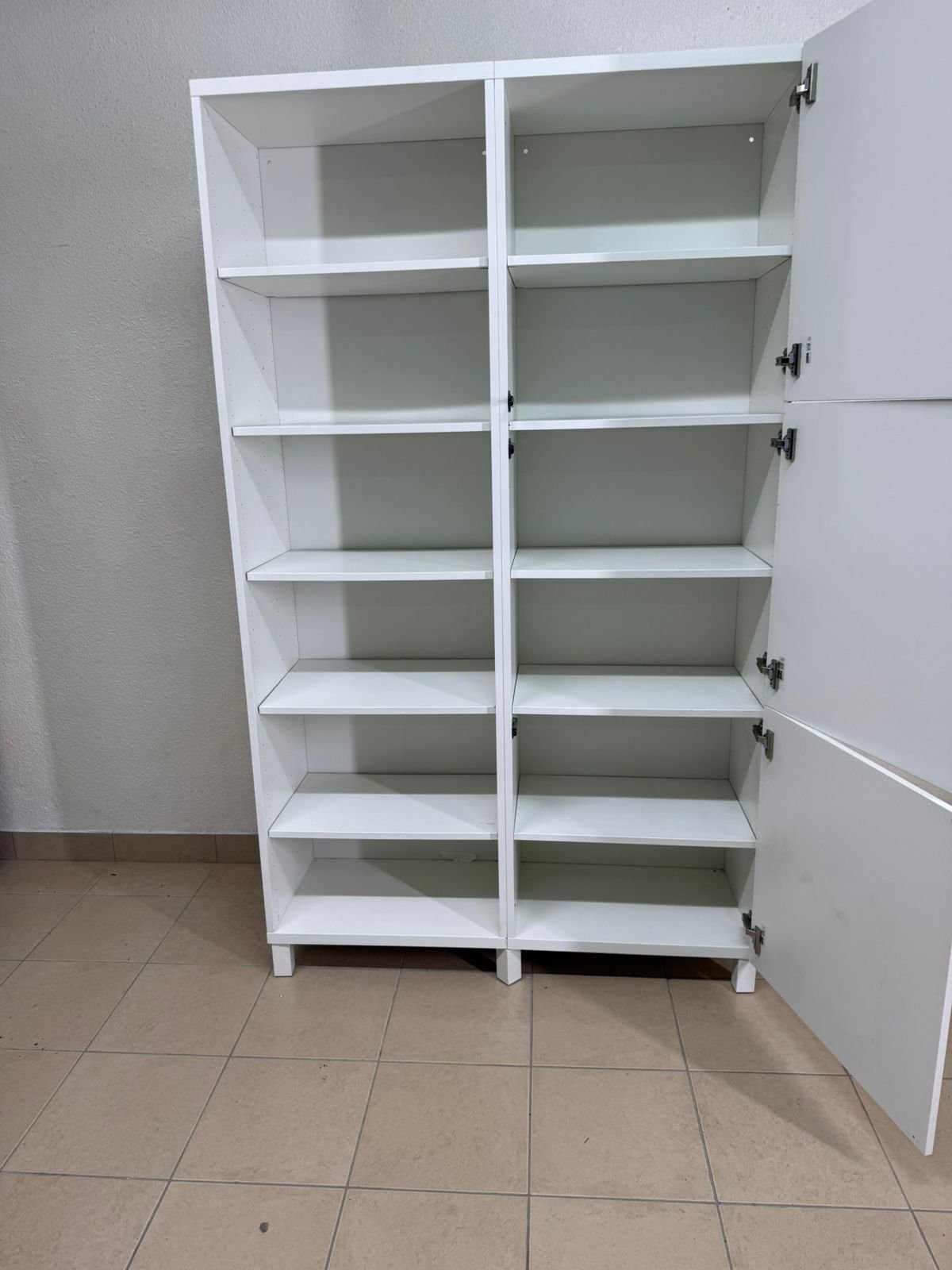 A white storage cabinet from IKEA, model BESTÅ, comes with open units and closed fronts. - Image 18