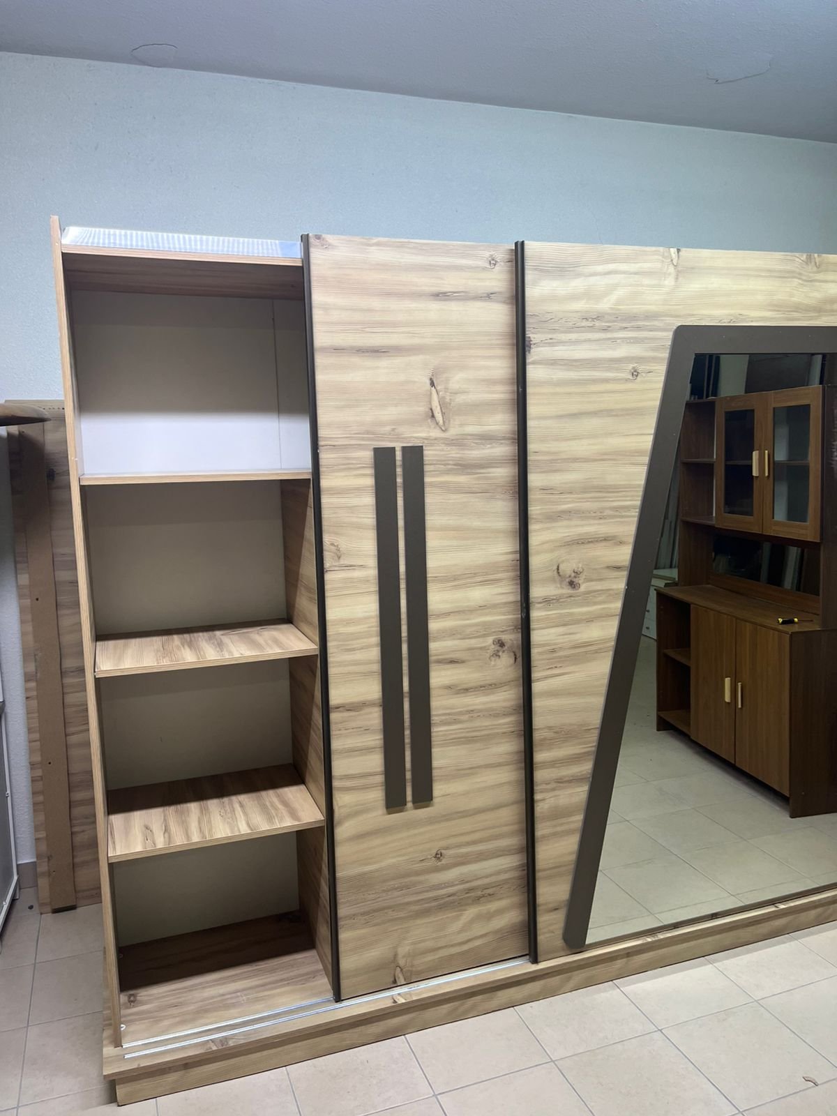 A modern sliding wardrobe combining wood and mirrors - Image 5