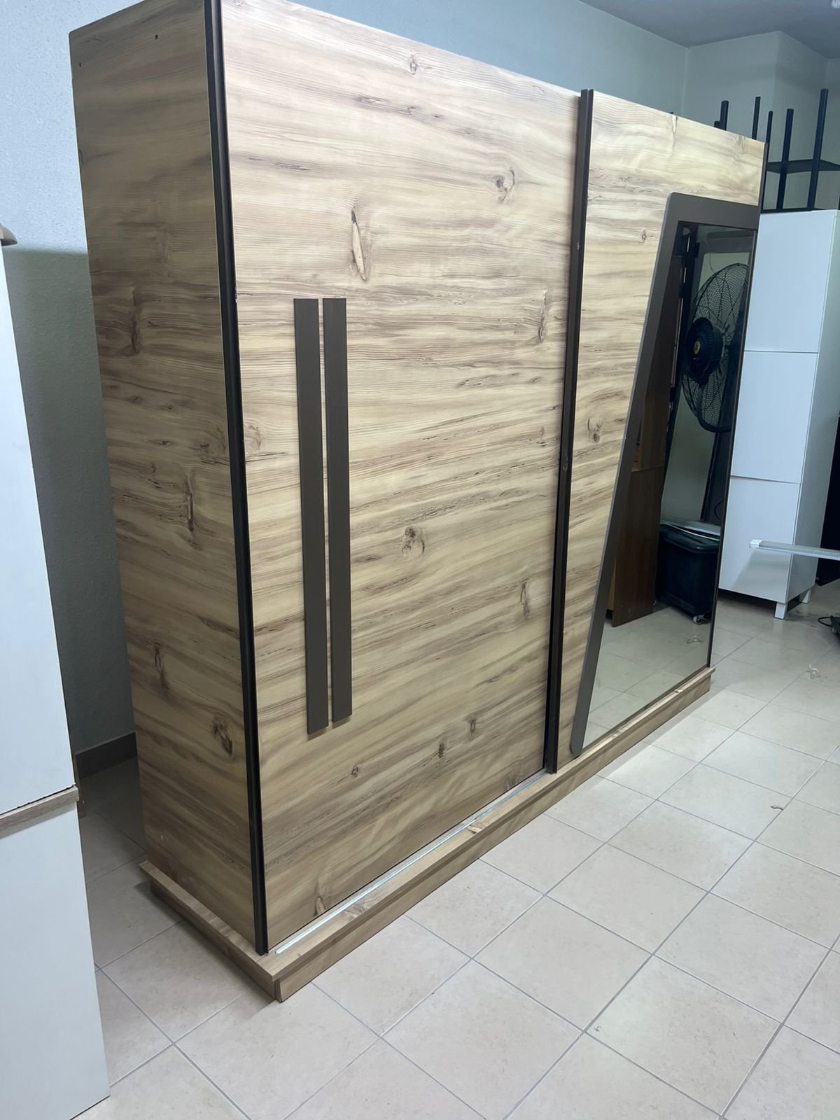 A modern sliding wardrobe combining wood and mirrors - Image 7