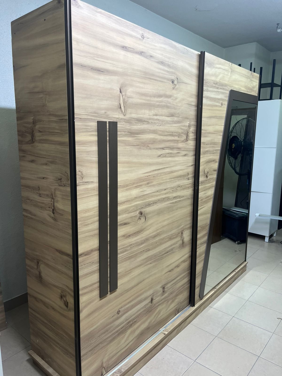 A modern sliding wardrobe combining wood and mirrors - Image 8