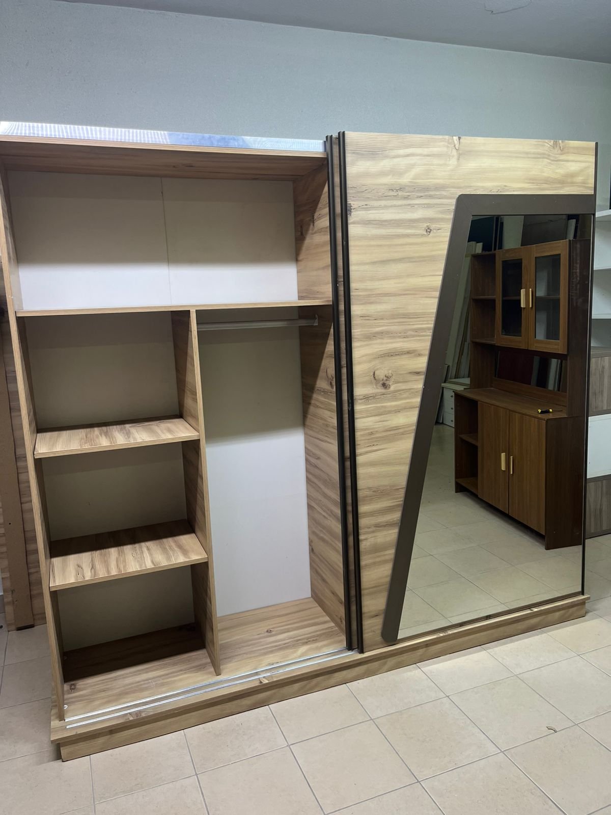 A modern sliding wardrobe combining wood and mirrors - Image 9