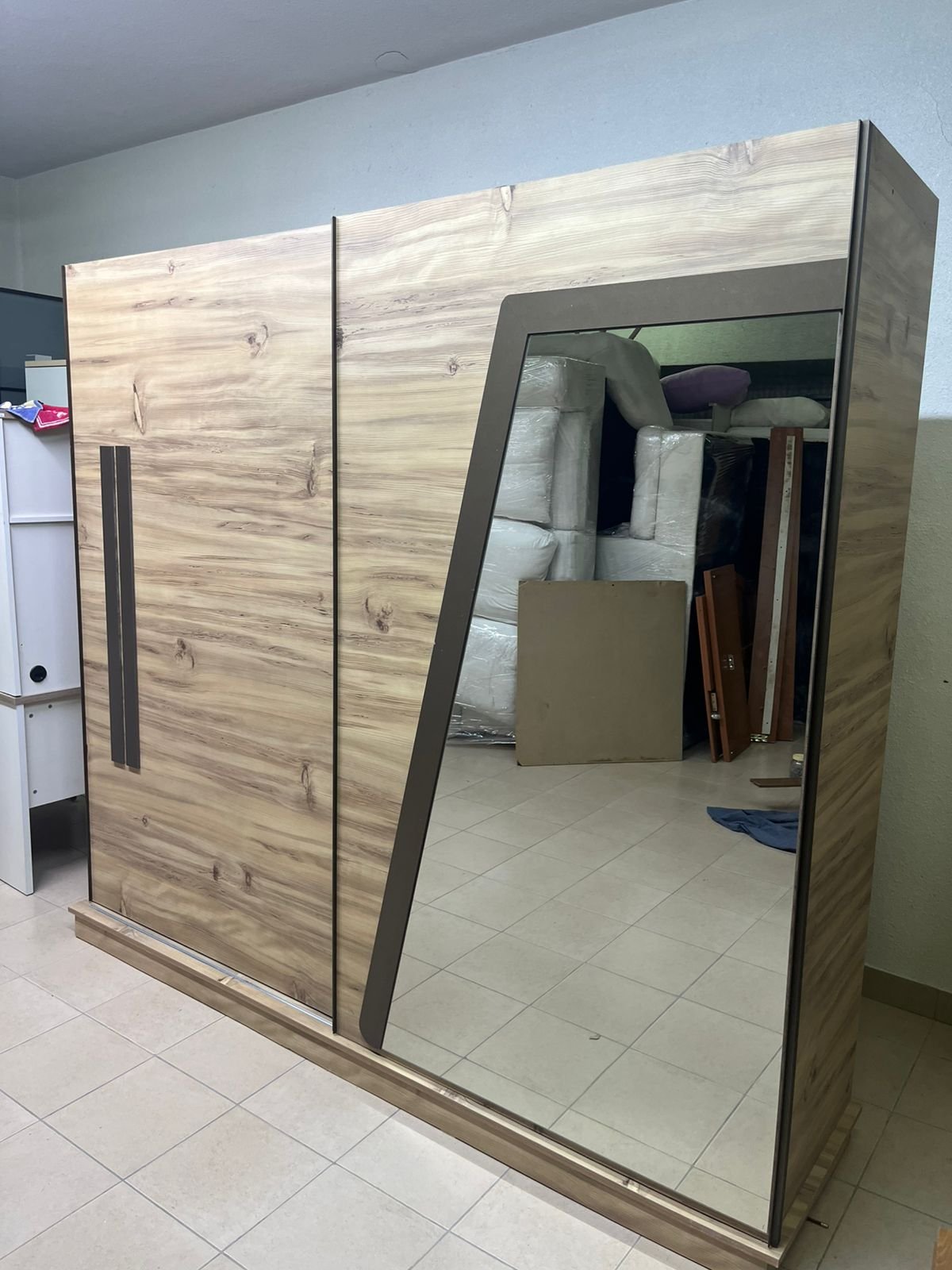 A modern sliding wardrobe combining wood and mirrors - Image 11