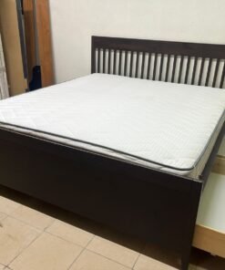 IKEA IDANÄS bed with a dark wood frame