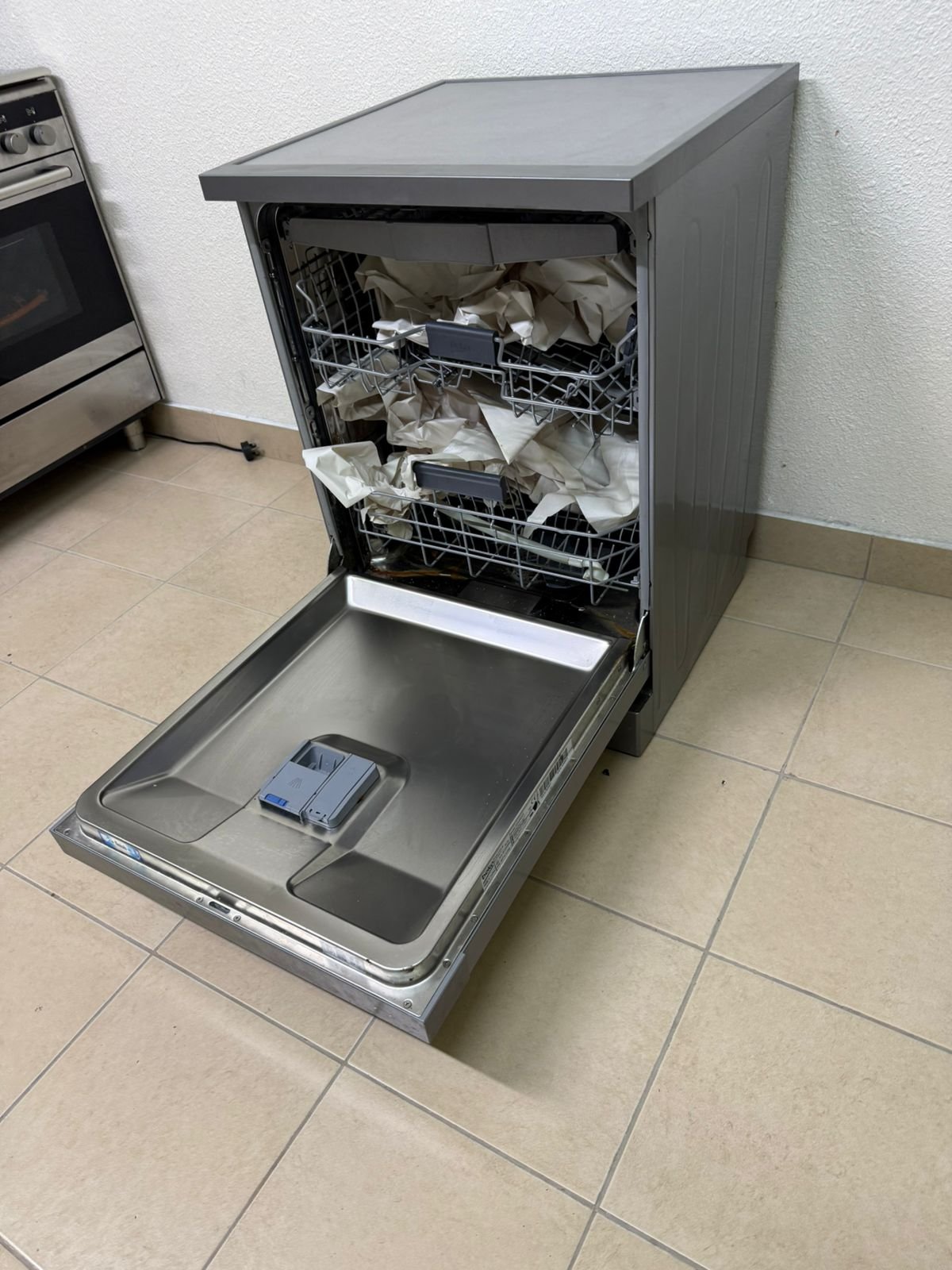 A freestanding dishwasher from Beko, featuring a silver color and modern design. - Image 9