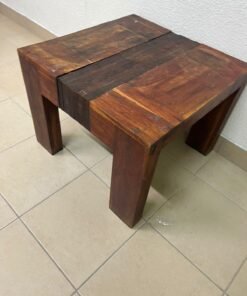 A side table or bench made from reclaimed teak in a rustic style