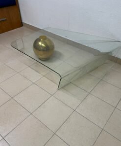 A glass coffee table with a "Waterfall" design, featuring curved transparent glass.