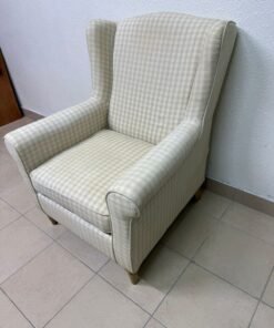 This chair is STRANDMON and features a light checkered pattern.