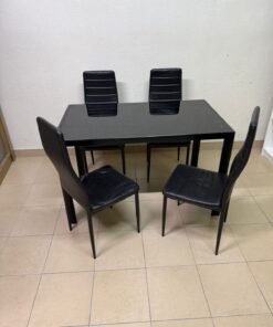 A modern black dining table set, including a table with a tempered glass top and leather chairs.