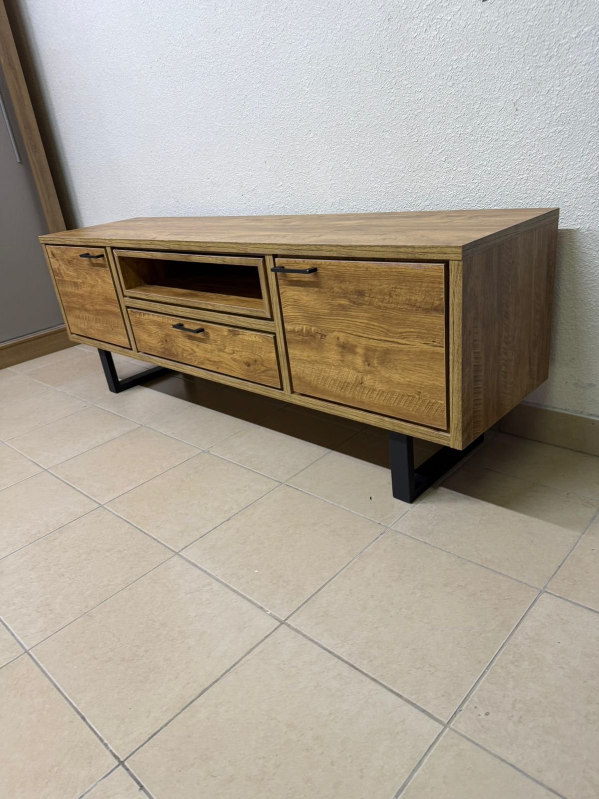 This modern TV unit features a warm beige wood finish and sturdy black metal legs. - Image 6