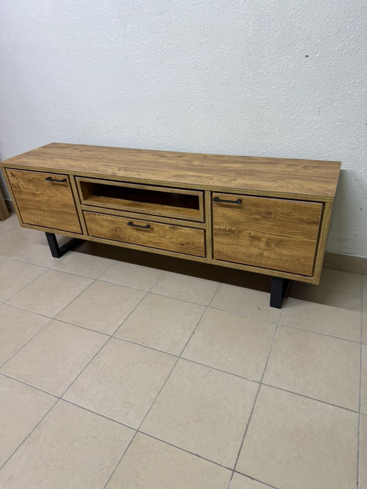 This modern TV unit features a warm beige wood finish and sturdy black metal legs. - Image 5