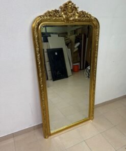 The mirror features a gold-rimmed frame with a "Louis" design from Home Centre.