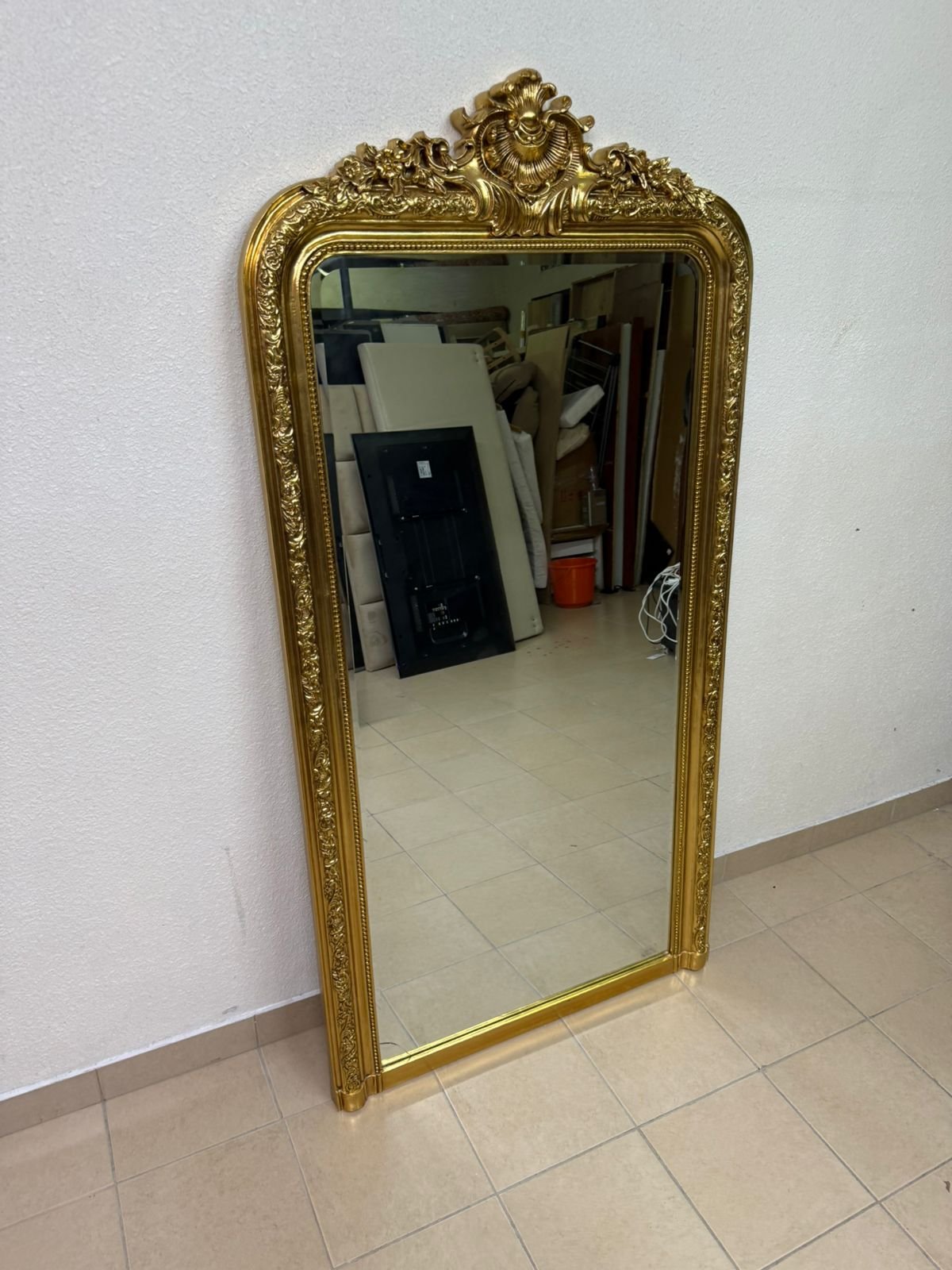 The mirror features a gold-rimmed frame with a "Louis" design from Home Centre.