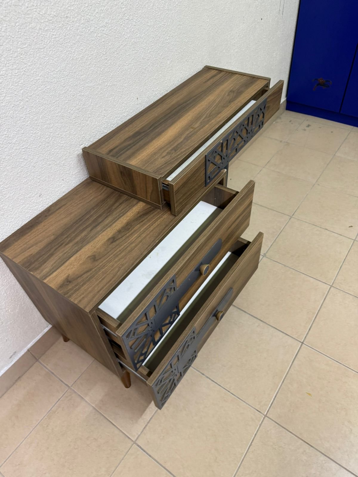 A modern dressing table with a wood-brown color and black geometric details. - Image 8