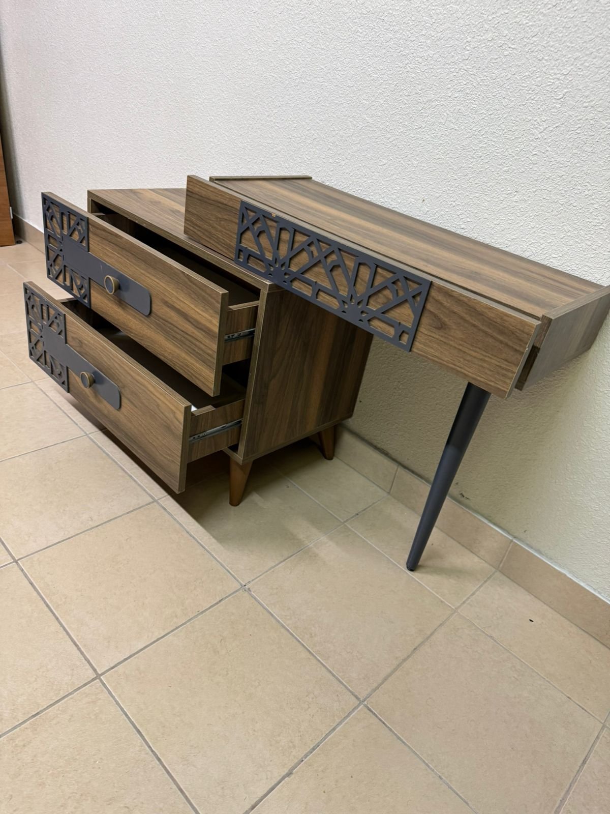 A modern dressing table with a wood-brown color and black geometric details. - Image 6