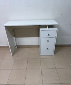 A modern white table with three drawers and shiny crystal handles.