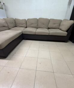 Beige and brown fabric sofa, intricate corner design