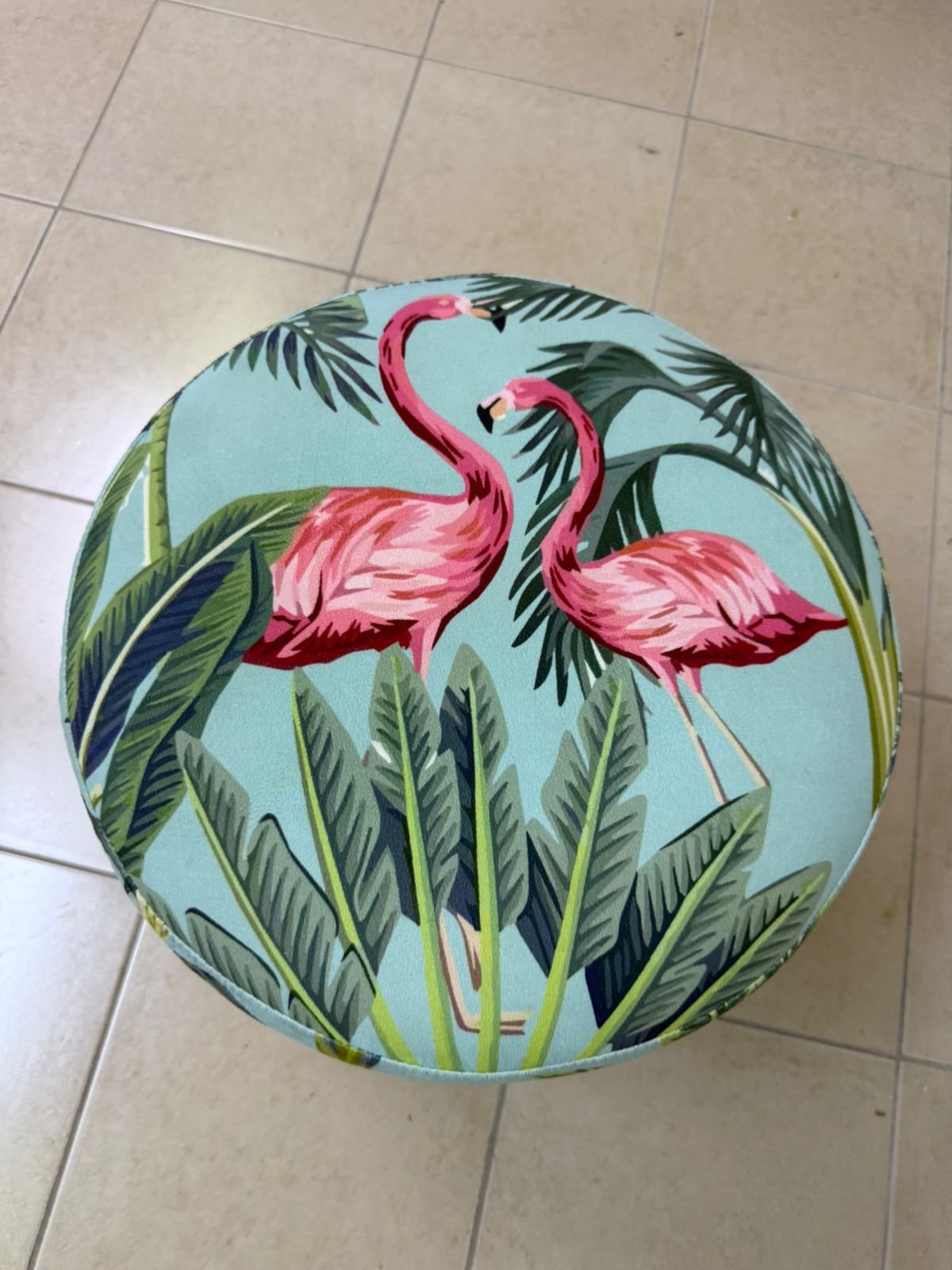 The ottoman from Home Centre features a tropical pattern depicting flamingos. - Image 6