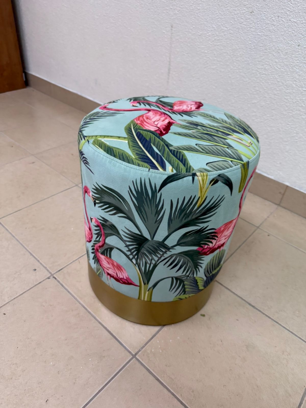 The ottoman from Home Centre features a tropical pattern depicting flamingos. - Image 5
