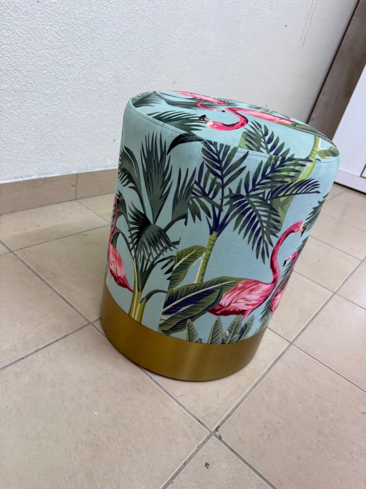 The ottoman from Home Centre features a tropical pattern depicting flamingos. - Image 4