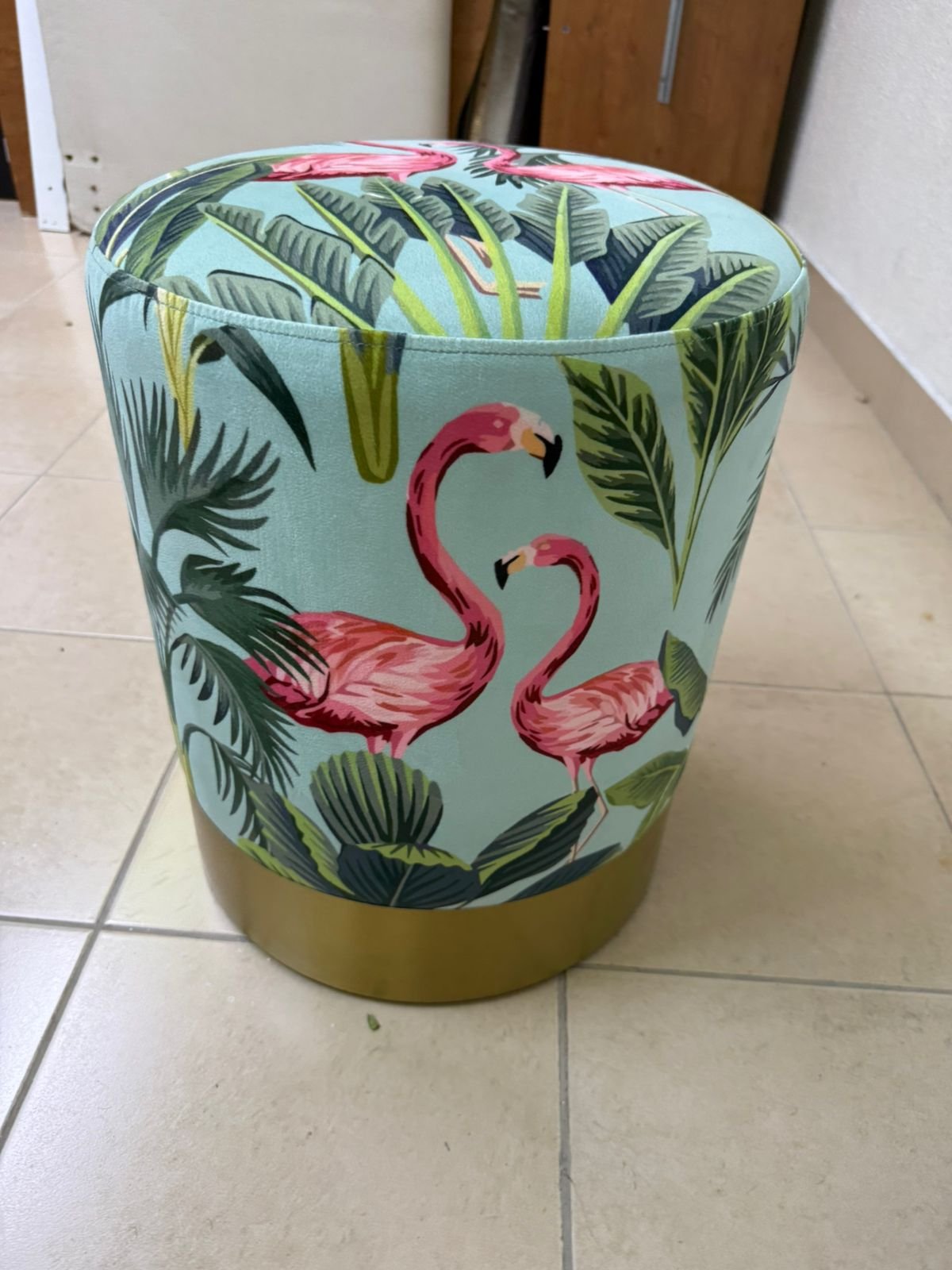 The ottoman from Home Centre features a tropical pattern depicting flamingos. - Image 7