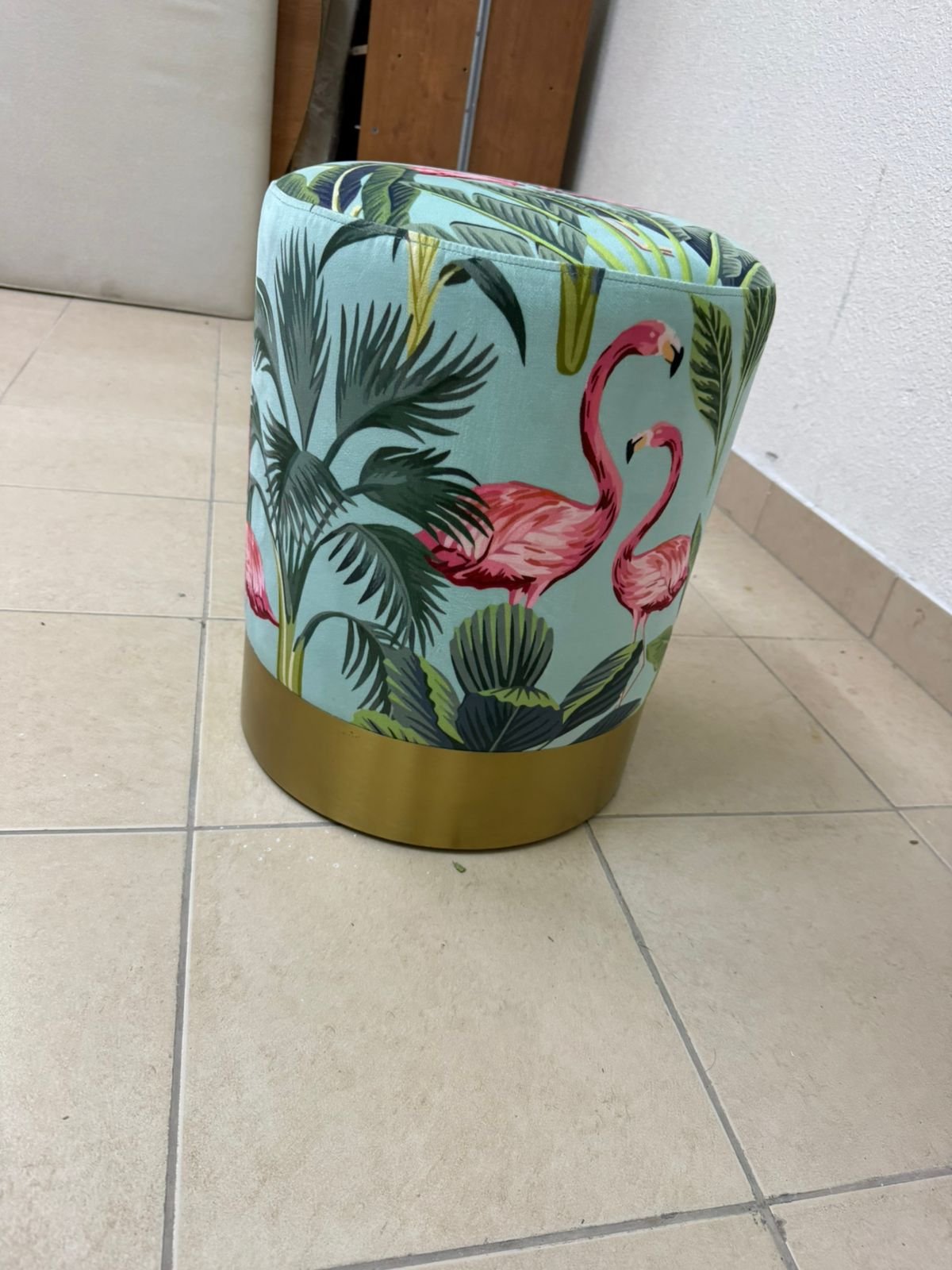 The ottoman from Home Centre features a tropical pattern depicting flamingos. - Image 2