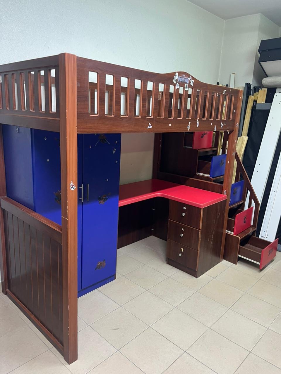 A multi-functional Spider-Man-themed loft bed for children, including a wardrobe, study desk, and stairs with drawers. - Image 6