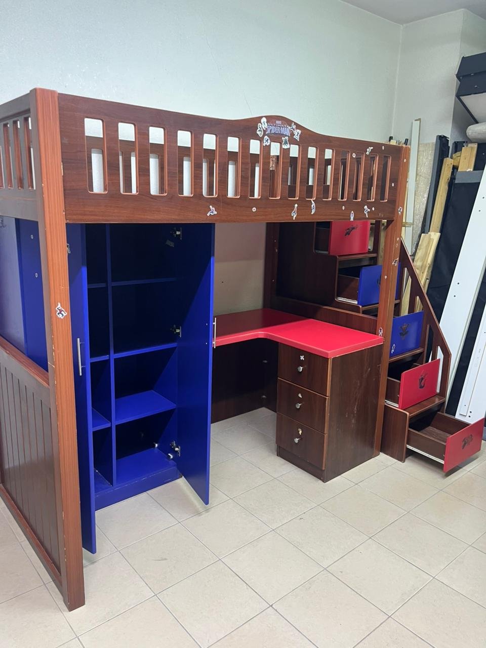 A multi-functional Spider-Man-themed loft bed for children, including a wardrobe, study desk, and stairs with drawers. - Image 7