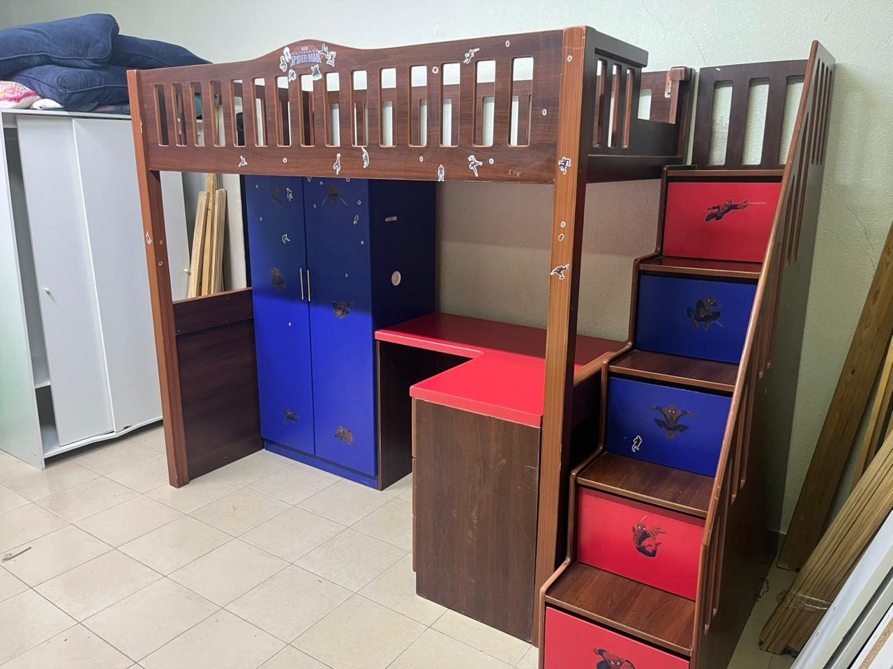 A multi-functional Spider-Man-themed loft bed for children, including a wardrobe, study desk, and stairs with drawers. - Image 2