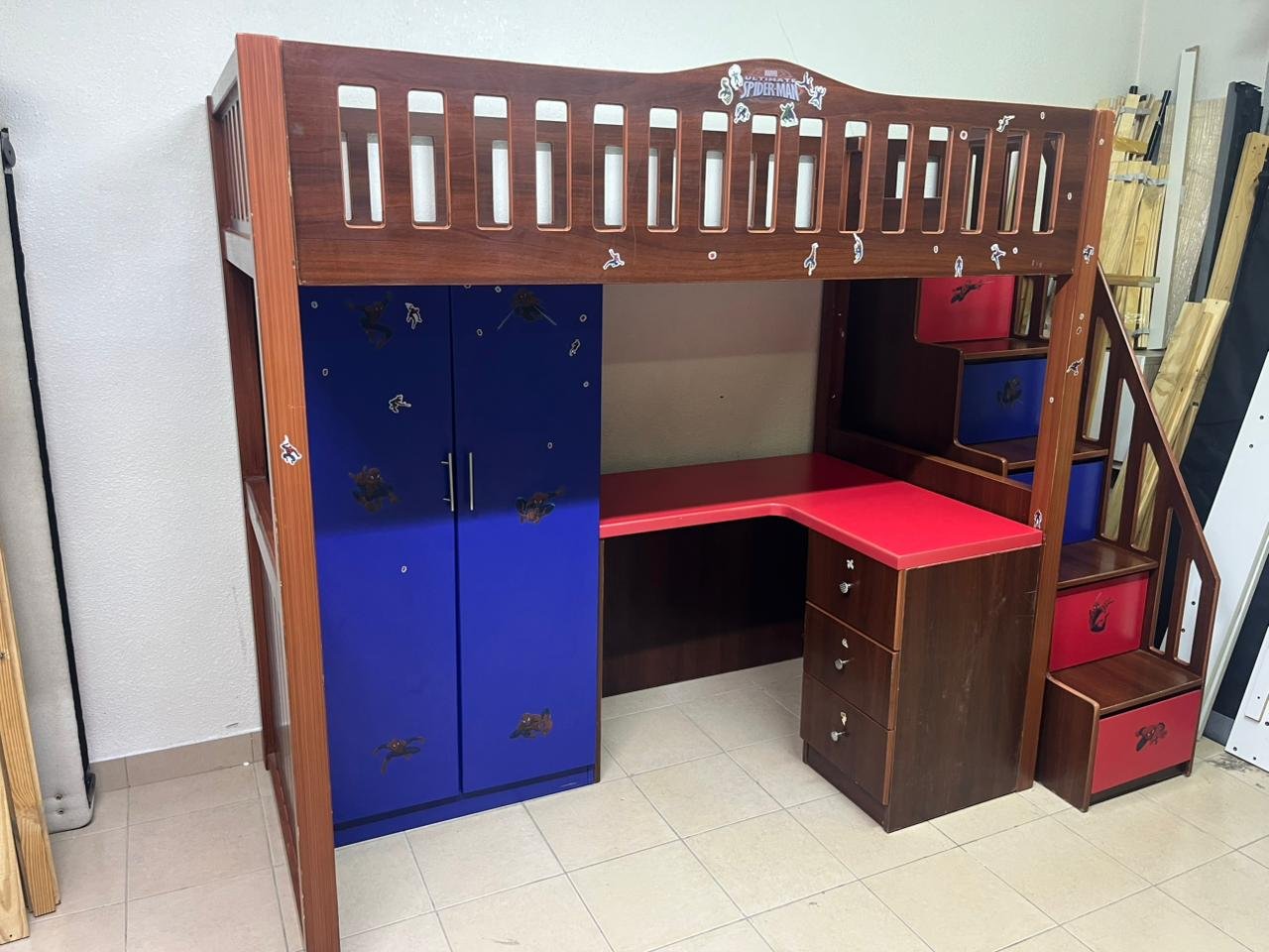 A multi-functional Spider-Man-themed loft bed for children, including a wardrobe, study desk, and stairs with drawers. - Image 4