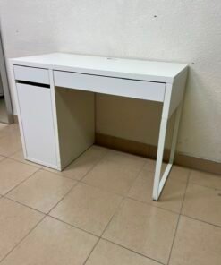 This is the IKEA Micke desk in white, featuring a simple design with one drawer and a lower storage unit.