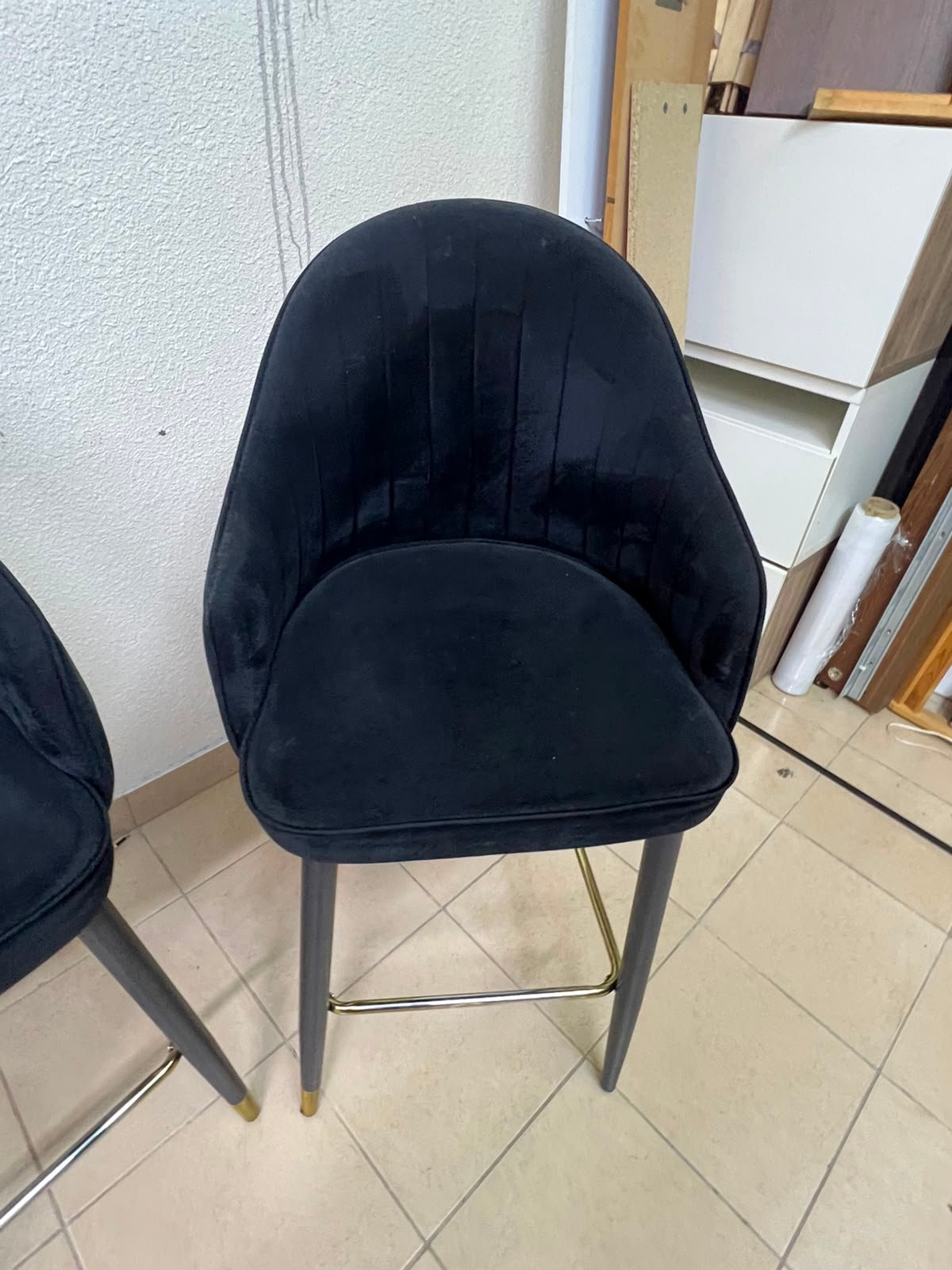 This black velvet bar stool from TUKA features a round design and black legs with gold accents. - Image 3
