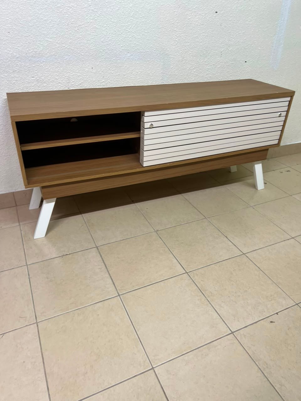 The "Reflekt" TV unit from "Pan Emirates" features a brown wood design with white sliding doors for a modern touch. - Image 11