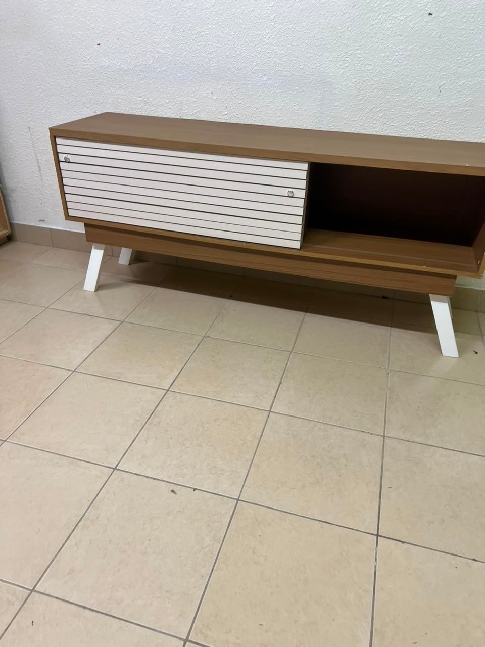 The "Reflekt" TV unit from "Pan Emirates" features a brown wood design with white sliding doors for a modern touch. - Image 12