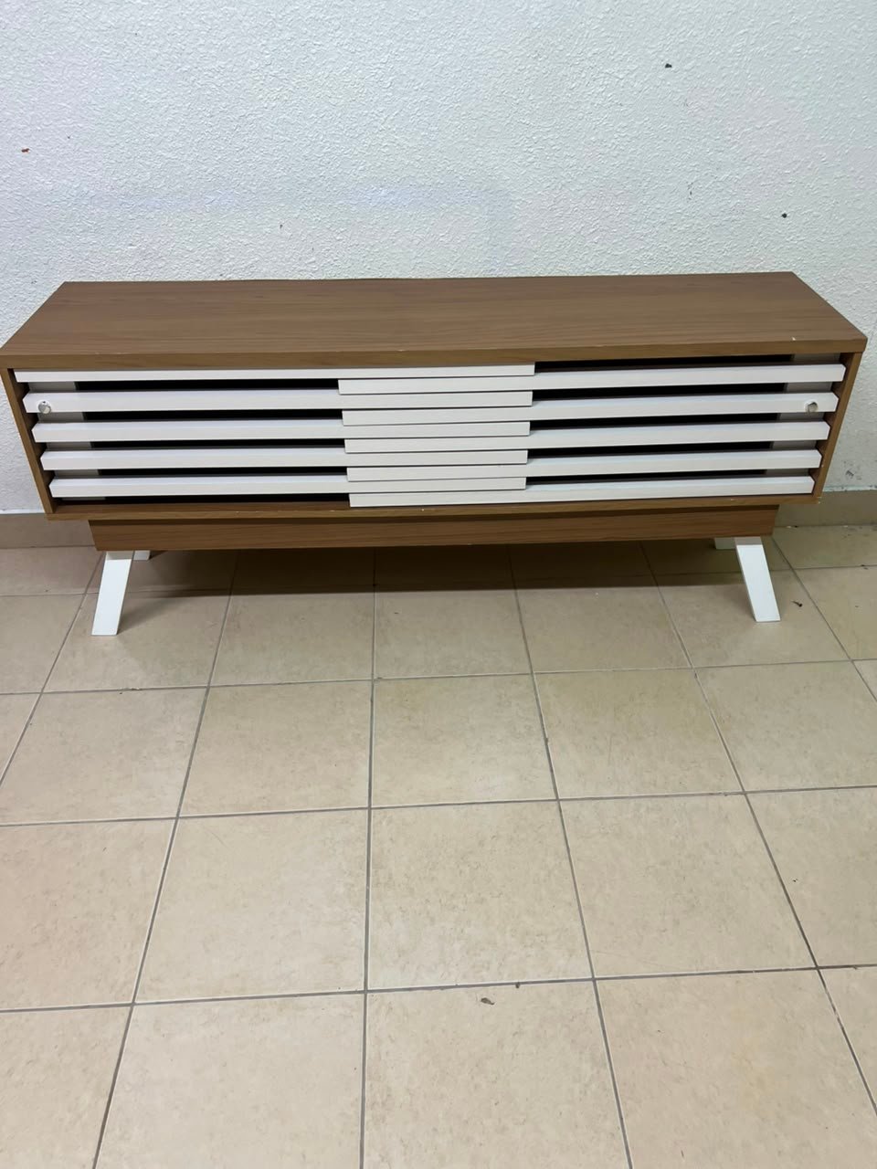 The "Reflekt" TV unit from "Pan Emirates" features a brown wood design with white sliding doors for a modern touch. - Image 6