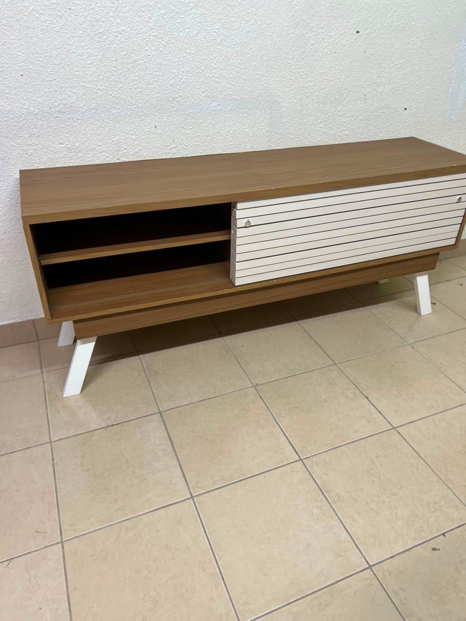 The "Reflekt" TV unit from "Pan Emirates" features a brown wood design with white sliding doors for a modern touch. - Image 5
