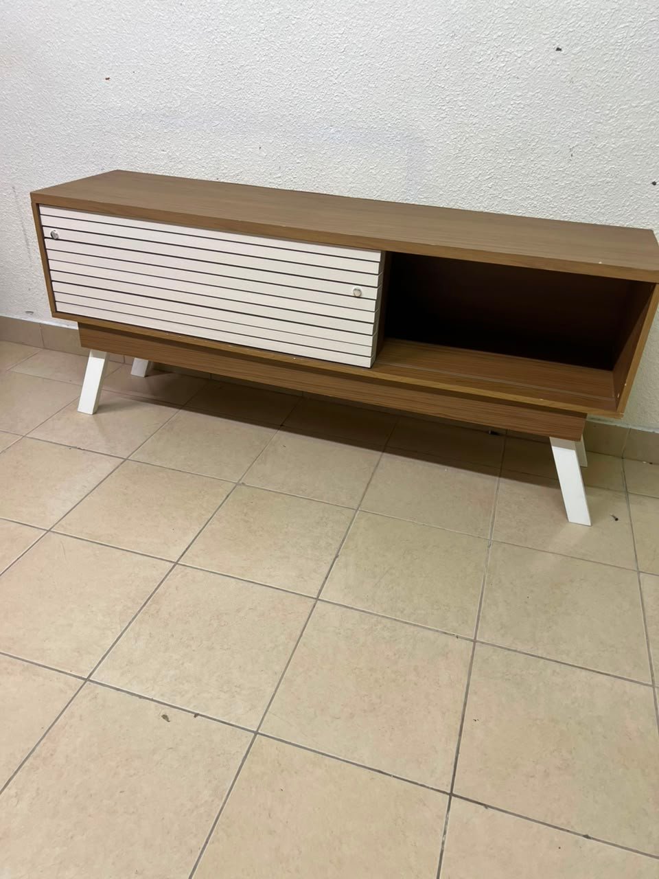 The "Reflekt" TV unit from "Pan Emirates" features a brown wood design with white sliding doors for a modern touch. - Image 4