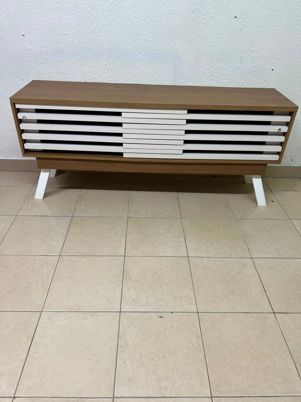 The "Reflekt" TV unit from "Pan Emirates" features a brown wood design with white sliding doors for a modern touch. - Image 8