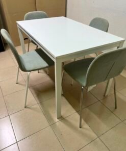 IKEA dining table set, combining a white table and chairs with light gray upholstery.
