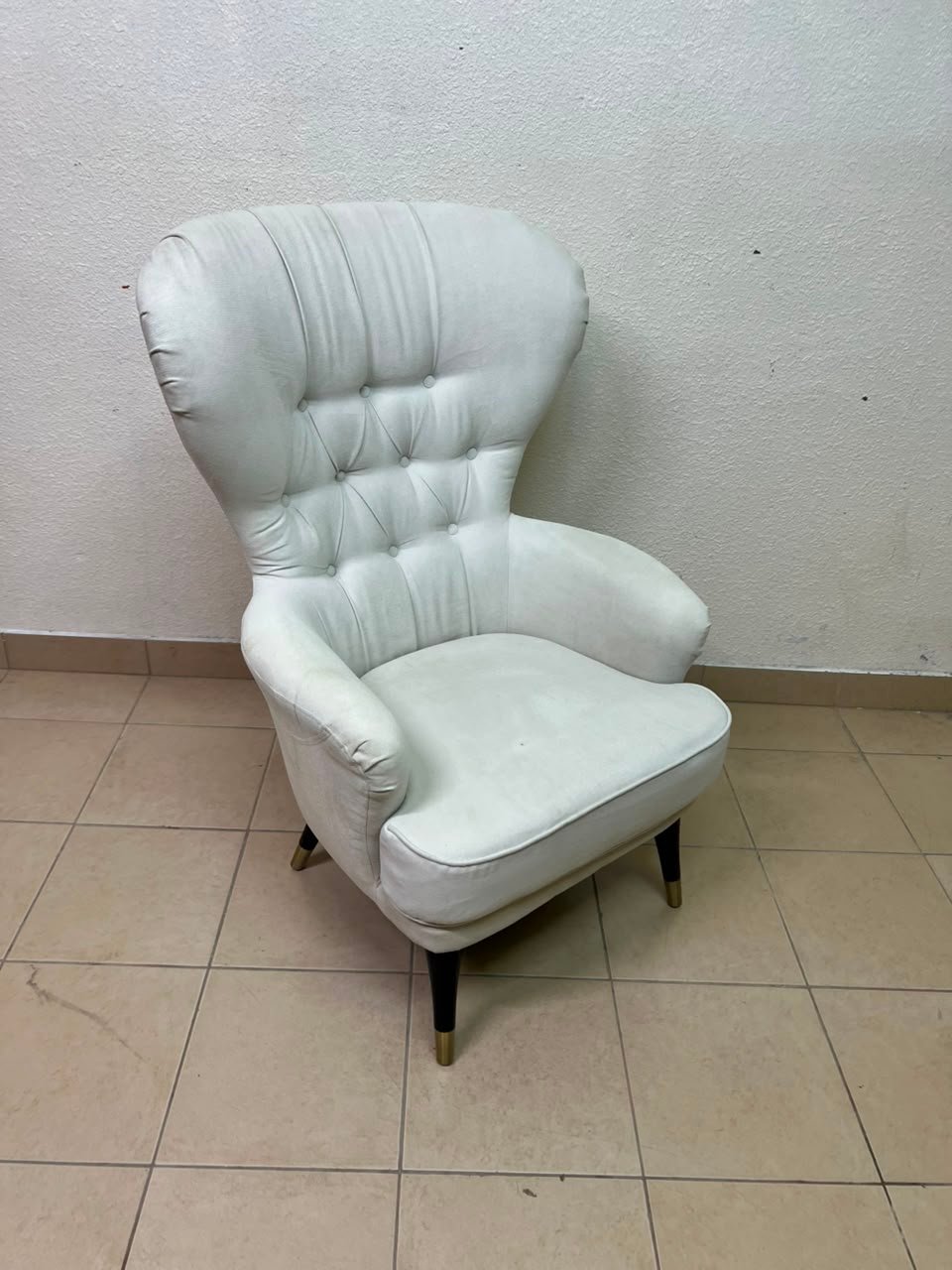 This wingback chair from AD CORE features white upholstery and a tufted back. - Image 2