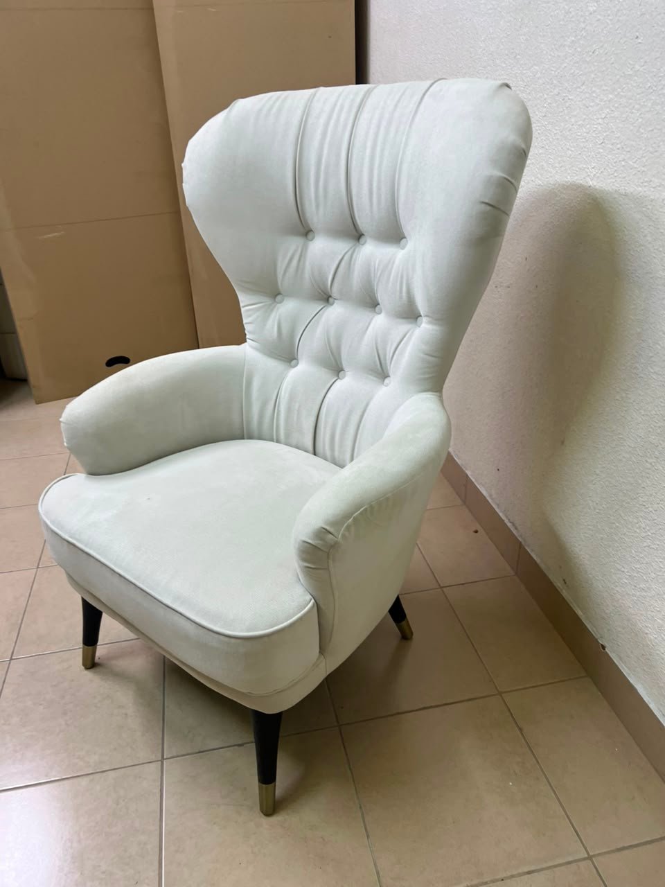 This wingback chair from AD CORE features white upholstery and a tufted back. - Image 14