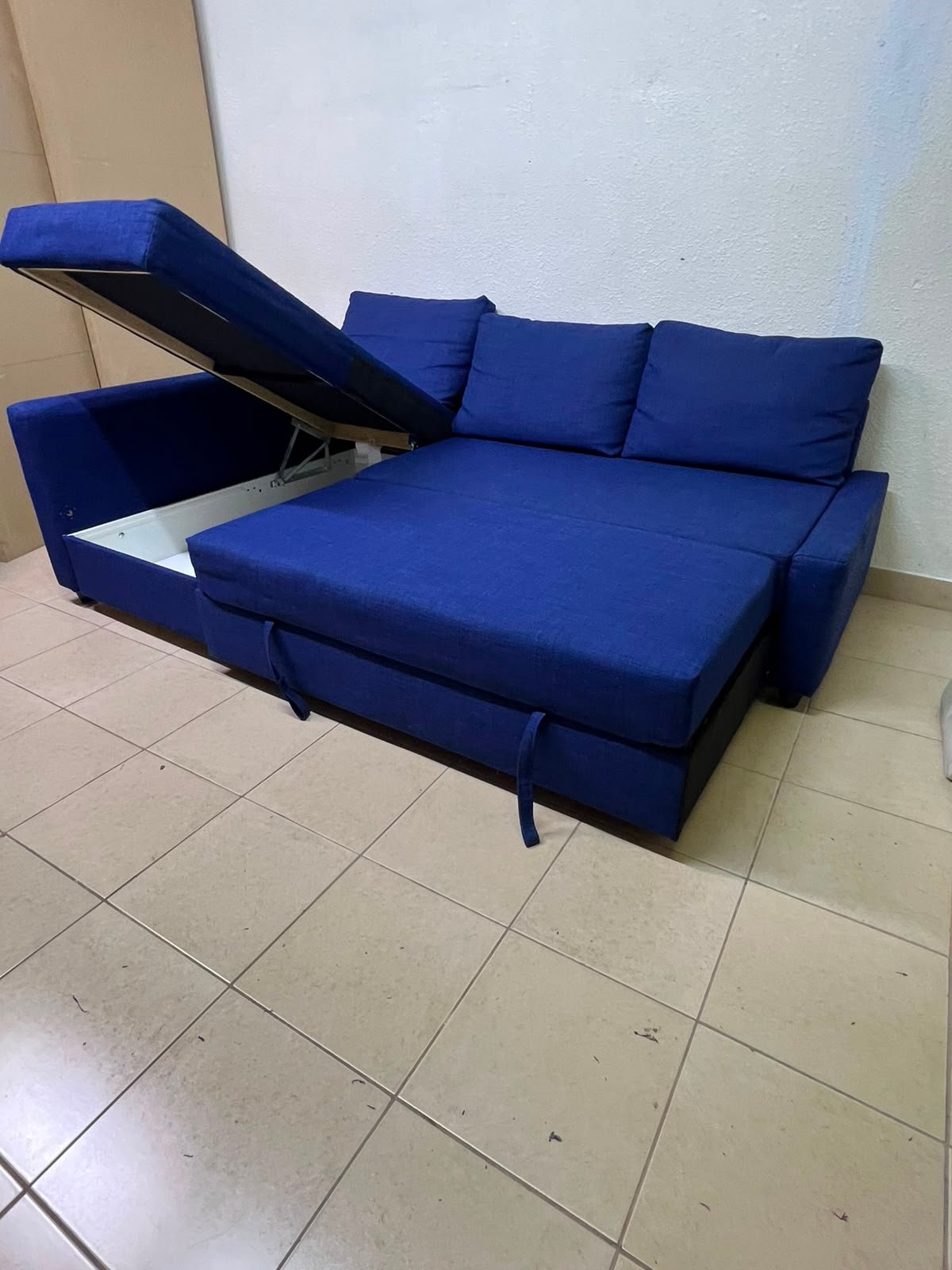 The IKEA FRIHETEN corner sofa-bed comes in dark blue and features built-in storage. - Image 4