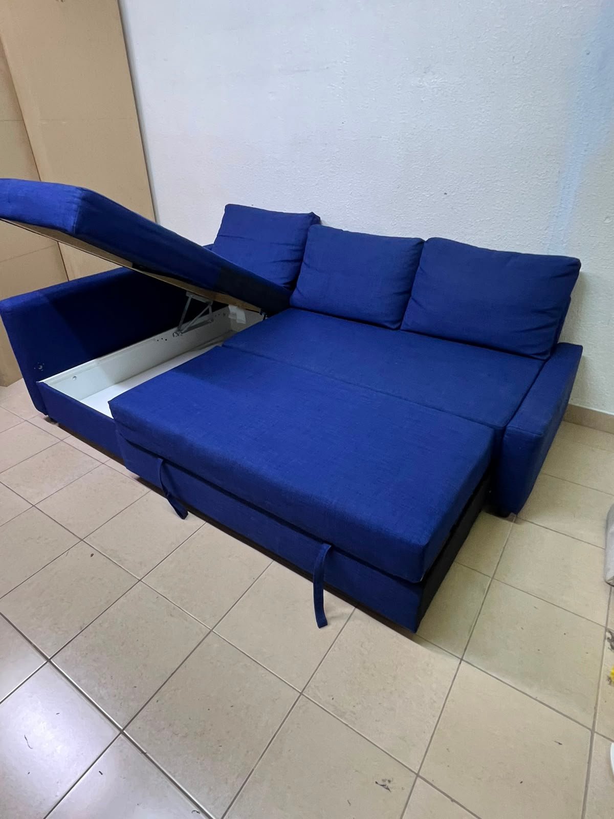 The IKEA FRIHETEN corner sofa-bed comes in dark blue and features built-in storage. - Image 16