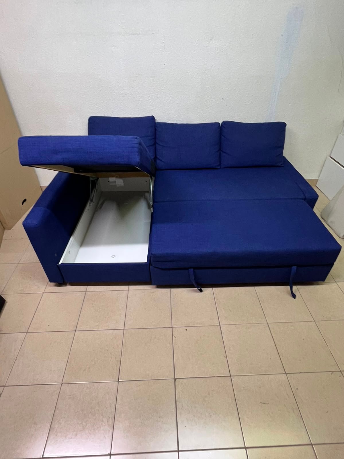 The IKEA FRIHETEN corner sofa-bed comes in dark blue and features built-in storage. - Image 13