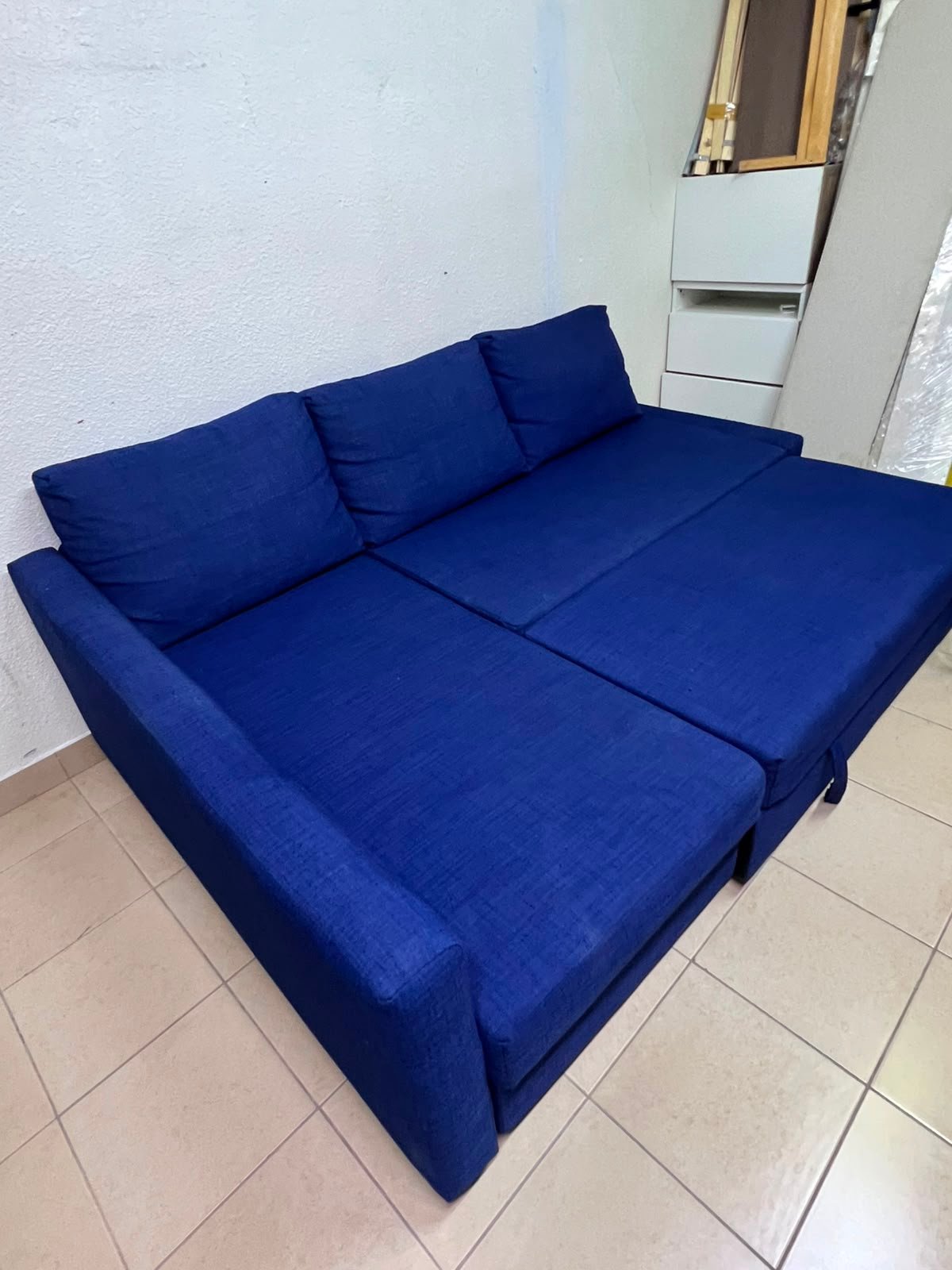 The IKEA FRIHETEN corner sofa-bed comes in dark blue and features built-in storage. - Image 5