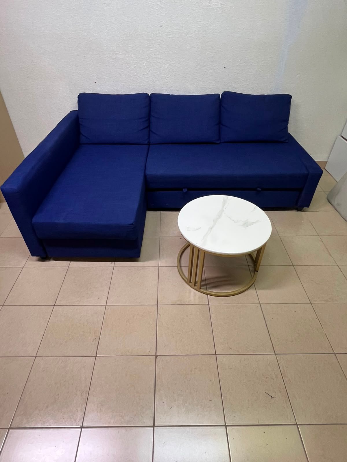 The IKEA FRIHETEN corner sofa-bed comes in dark blue and features built-in storage.