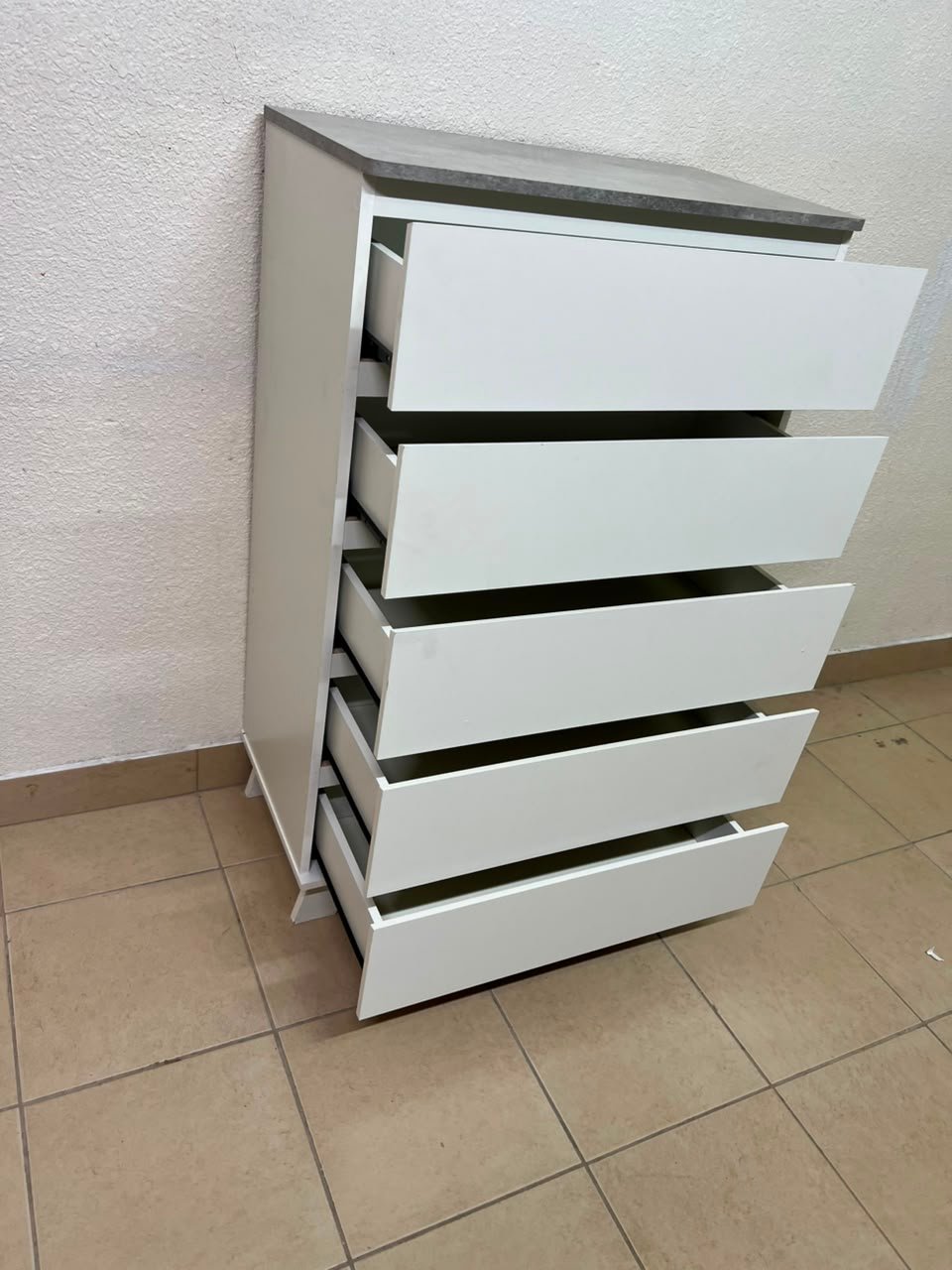 A modern white chest of drawers with a concrete-gray top, similar to models like the Colin from IKEA - Image 2
